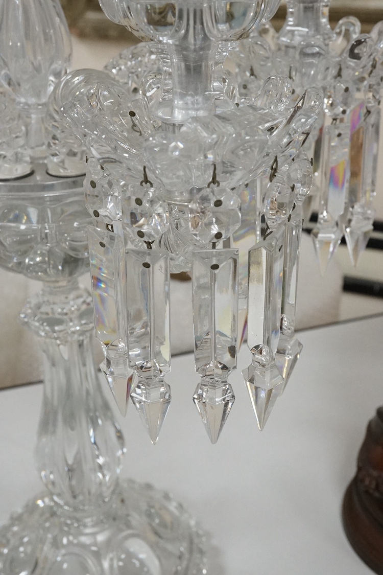 A Baccarat style moulded glass five branch candelabrum (lacking one arm), 58cm high. Condition - good, lacking one arm